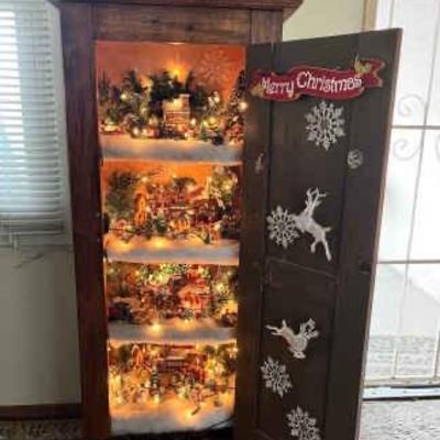 https://ctbids.com/estate-sale/34797/item/3903570/Christmas-Village-Cabinet