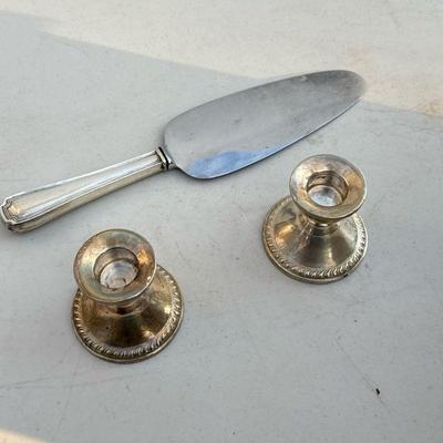 (3pc) Sterling Silver | Including a pair of weighted sterling silver candle stick holders and a silver handled cake server, each with...