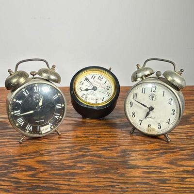 (3pc) Alarm Clocks | Including two Gabriel alarm clocks, one "Luminos", and a Tidey Furnace Clock. - dia. 4 in (Largest)

