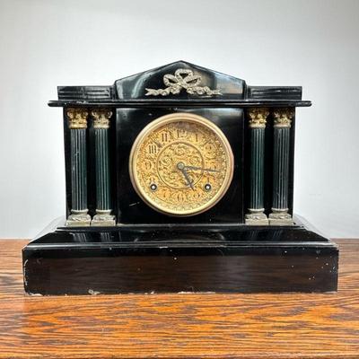 Enameled Shelf Clock | Heavy black enameled metal mantel clock with pressed brass scrollwork face with Arabic numerals, with keys. - h....