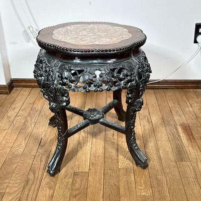 Chinese Carved Side Table | Dark or ebonized wood, with overall carved grape leaf motif, having a shaped inset marble stone top over a...