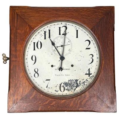 Seth Thomas Hudson Clock | 30 Day "Hudson" wall clock, oak case, the face with Arabic numeral markers. - h. 19 x w. 19 x d. 5.5...