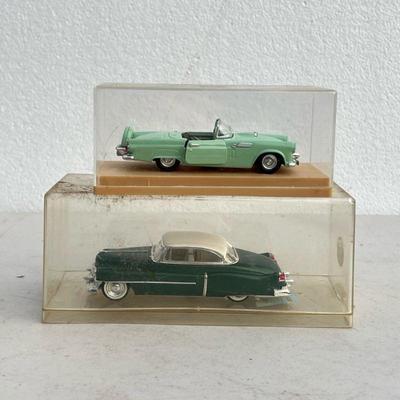 (2pc) Model Cars | Two green model cars in cases. - l. 7 in (Largest case)

