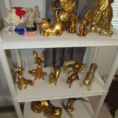 Sale Photo Thumbnail #96: Many pieces of Anthony Freeman Mcfarlin gold leaf ceramic figurines. Several signed.