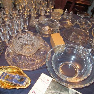 Several nice sets of glasses, bowls, platters etc.