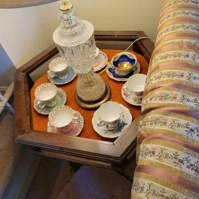 china tea cups, saucers, display glass top end table