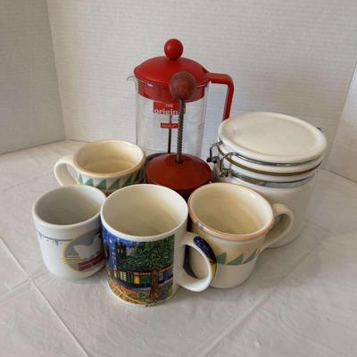 Coffee Lot: French press, mugs, and coffee canister