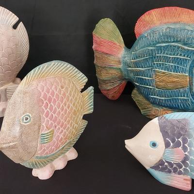 FOUR CARVED AND COLORFUL TROPICAL FISH FIGURES FROM THE 80s