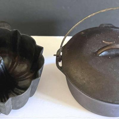 Lot 140: Cast Iron Dutch Oven And Bundt Pan, Skillets, Pots, And Heavy White Dutch Oven