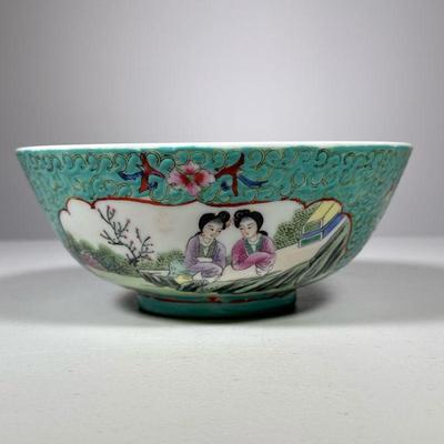 Chinese Porcelain Bowl | Marked Hong Kong on bottom, decorated with two maidens in garden under tree in reserve, with shades of green and...