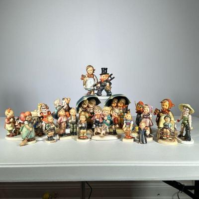 (20pc) Hummel Figurines | A variety of the iconic Hummel figurines including “Apple Tree Boy” and “Little Bookkeeper”. - h. 5.5 x w. 4 in...