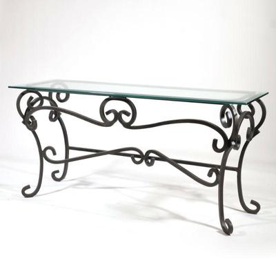 Metal & Glass Console Table | Thick beveled edge glass top over a scrolled metal base. - h. 27.25 x l. 56 x d. 18 in

