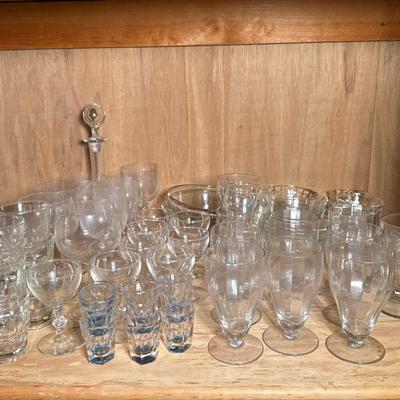 BACCARAT DECANTER & OTHER GLASSWARE | A large mixed lot of clear glassware and dishes including one Baccarat crystal glass decanter...