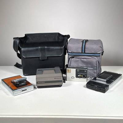 (4pc) Polaroid & Kodak Cameras | 3 Polaroid cameras and one disc camera, including a black leather Polaroid carrying case. - h. 8 x...