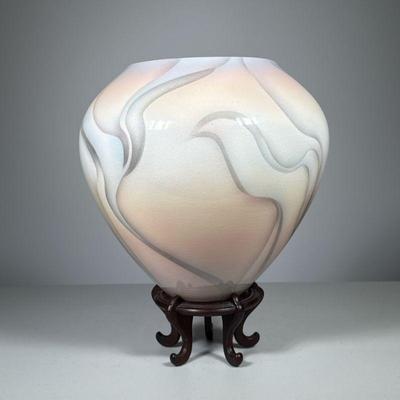 Contemporary Vase | Signed urn in shades of peach, blu and taupe, on a Chinese style wooden stand, signed on the bottom. - h. 13 x w. 10...