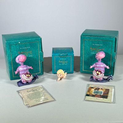 (3pc) Disney Collectibles | From the Disney Classics Collection: Two identical Cheshire Cats from Alice in Wonderland both with COAs and...
