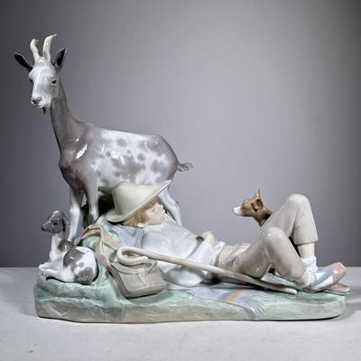 Shepherd LLadro | Lladro porcelain group showing a boy in hat sleeping with staff by his side, as goats and a dog surround him. Marked on...