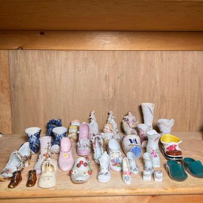 (32pc) MIXED PORCELAIN & OTHER SHOES | Mixed lot of porcelain & other shoe figures, including English, Italian, and Japanese...