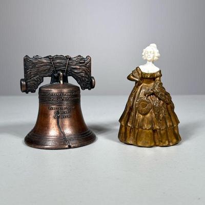 (2pc) Metal Bells | Including a heavy brass or gilt bronze bell of a woman in dress with carved bone face after Peter Tereszczuk, and a...