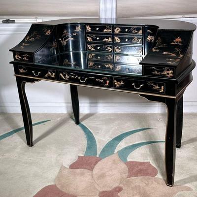 Chinoiserie Lacquered Desk | Black lacquered harpsichord style writing desk of curved shape, the top having multiple compartments, with...