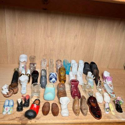 GLASS, CERAMIC, & OTHER SHOE FIGURES | Mixed lot of glass, ceramic, wood, and other shoe figurines, with makers including C. B....
