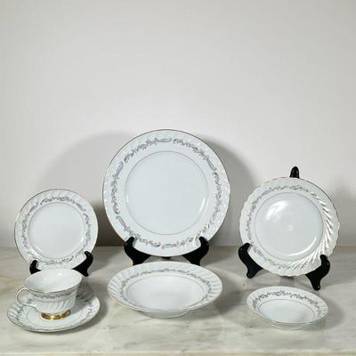 Meito China Service | Service for twelve, icluding cups and saucers, dinner plates, low bowls, and lunch or dessert plates.