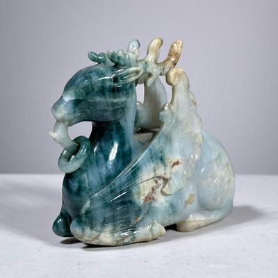 CHINESE CARVED JADE MYTHICAL FIGURE | Jade or Serpentine stone, a winged deer carved with rings, no apparent marking. - h. 6 x w. 2 x l....
