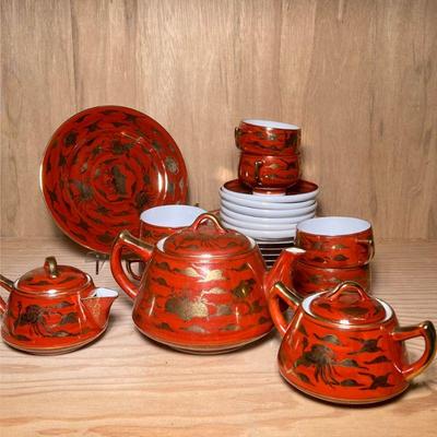 (21pc) RED & GILT CHINESE TEA SET | Red & gilt decorated Chinese porcelain tea set including: 6 small plates, 6 teacups &...
