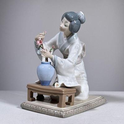 LLadro Japonaise Figure | Lladro porcelain figure of a woman in kimono with vase of flowers, marked on the bottom. - h. 7.5 x w. 4.25 x...