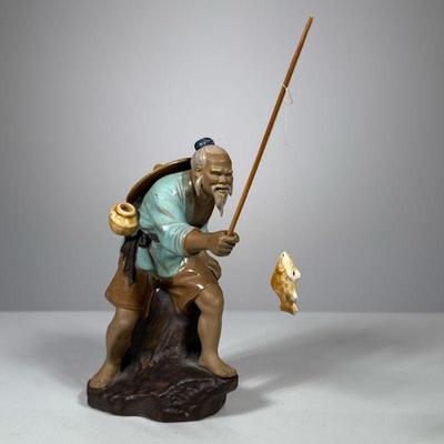 Chinese Fishing Figure | Porcelain statue of barefoot man with hat and beard with caught fish. Marked China on bottom. - h. 9.5 x w. 4 x...