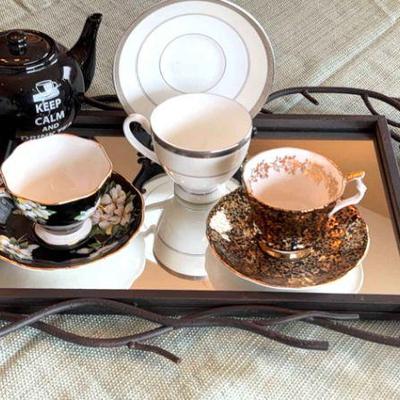 Tea cups pot & a metal framed mirror