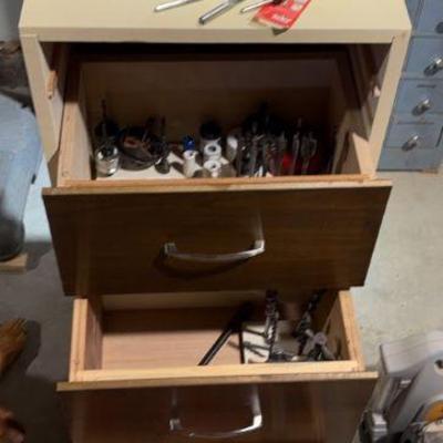 Cabinet full of drill bits other items