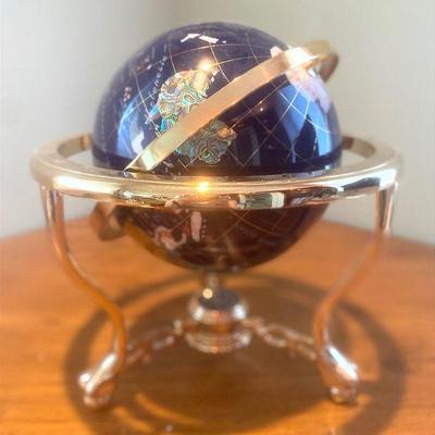 Rotating world globe in minerals semi precious stones compass in base
