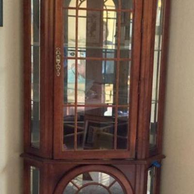 Lighted corner curio cabinet