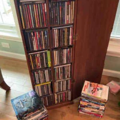 Two sided tower of music cd s, & movie dvd’s, & blue ray discs