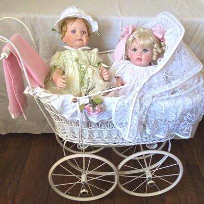Two Dolls In White Wicker Buggy