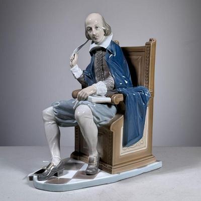 Lladro Shakespeare | Lladro porcelain figure showing Shakespeare sitting in chair with book and quill in hands, in shades of taupe, gray...