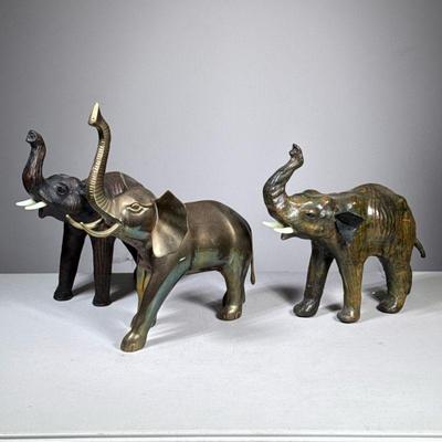 (3pc) Brass & Wood Elephants | Including a heavy brass elephant and a pair of carved wood elephants with applied resin tusks. - h. 14...