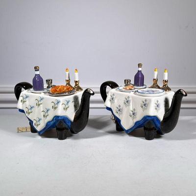 (2pc) Judaica Teapots | Teapots made by Tony Carter in England, one depicts a Sedar dinner, the other Shabbat, each numbered and marked...