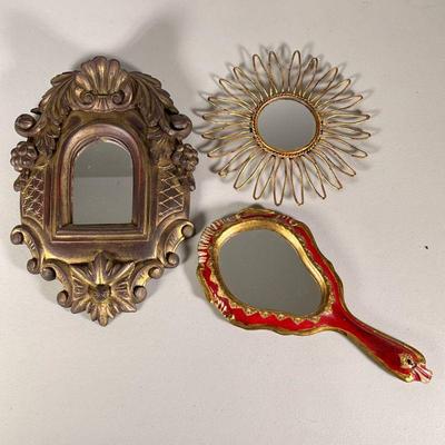 (3pc) Gold Mirrors | One handheld red/gold mirror made in Italy (12 x 6 in.), a heavy gold framed mirror with carved grapes, leaves, and...