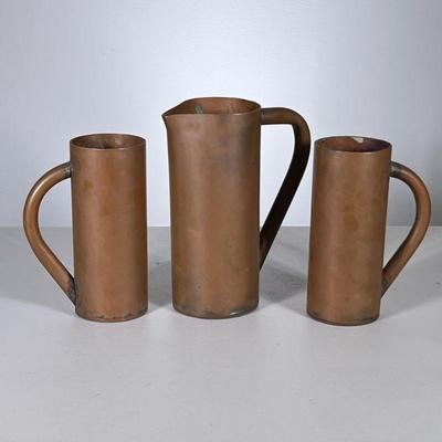 (3pc) HEAVY COPPER PITCHER & CUPS | Heavy copper or other metal pitcher and a pair of matching cup; no apparent markings. - h. 8 x w....