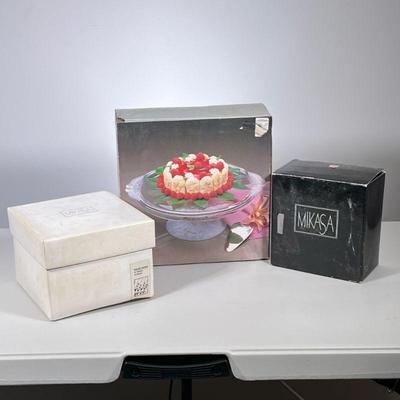 (3pc) [NIB] MIKASA CRYSTAL | Various new in box Mikasa crystal including: Bountiful Footed Cake Stand, Pair Oxford Candlesticks, and an...