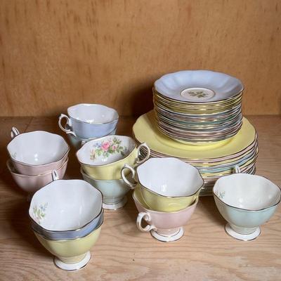 Royal Albert Bone China Tea Set | Royal Albert pastel porcelain tea set including: 11 tea cups, 12 saucers, and 12 small plates. - dia. 8...