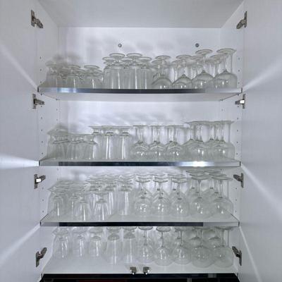 Cabinet of Barware | A large collection of mostly Arcoroc Stemware Glasses, including wine glasses, water goblets, and more.


