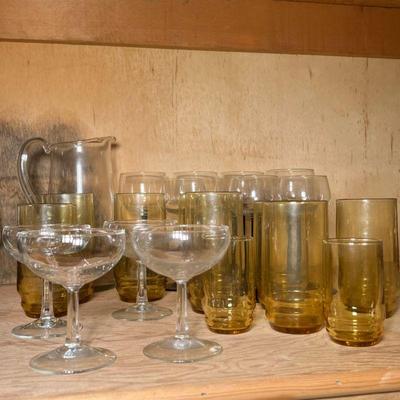 (23pc) MIXED GLASSWARE | Mixed lot of glassware including: 4 champagne glasses, 10 yellow glasses, 8 colored stemware glasses, and a...