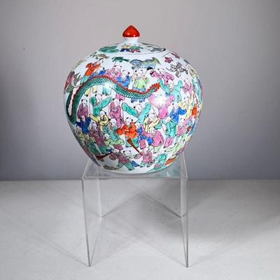 CHINESE LIDDED JAR | Lidded Chinese jar decorated with various figures and scenes in bright colors, with red four character mark on the...