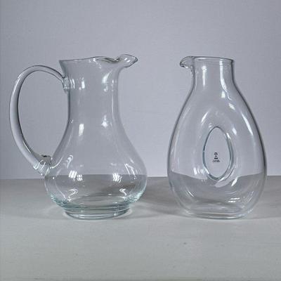 (2pc) Glass Pitchers | Including a clear glass pitcher with handle and a Skruf Sweden wine pourer, with etched signature on the bottom. -...