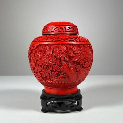 Cinnabar Vase | Carved Chinese cinnabar vase of small size with lid on a carved wood black stand. - h. 6 x dia. 5 in

