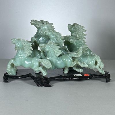 Chinese Soapstone Horse Carving | Stallions running, carved in light green stone, on conforming wood stand. - h. 8 x l. 15 x d. 6 in (on...