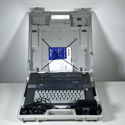 VINTAGE SHARP PA-3260 TYPEWRITER | "Calcutyping" electric typewriter in carrying case and with Operation Manual.

